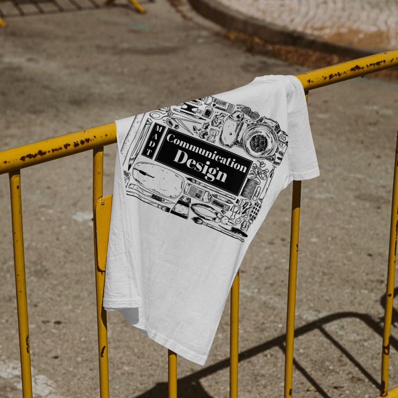 MADT Communication Design t-shirt draped over a railing